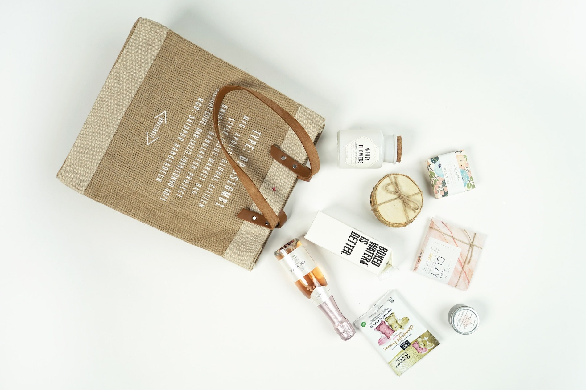 Jute shopping bag with products spilling out