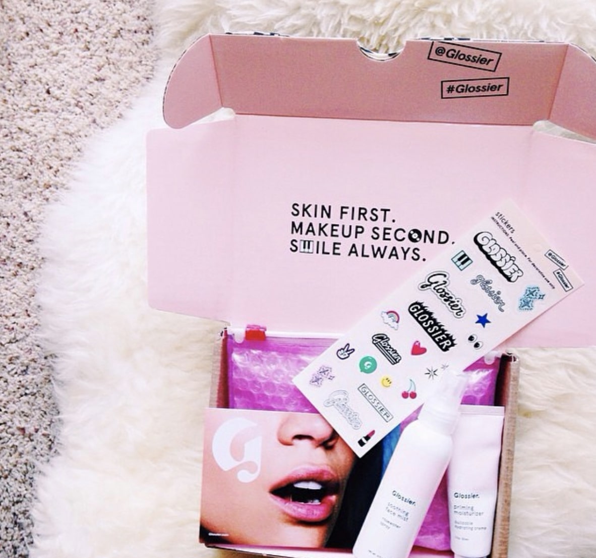 Branded eCommerce packaging by Glossier